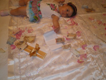 baby girl lying on the marital mattress